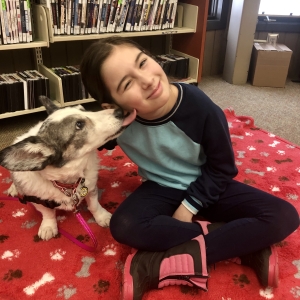 Myrtle reads with a student.